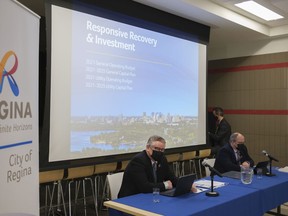 Chris Holden, city manager, and Barry Lacey, executive director of financial strategy & sustainability, from left, at a press conference about the upcoming budget at City Hall on March 5, 2021.