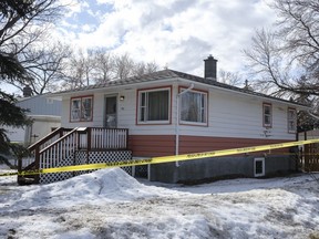 A home in the 100 block of St. John St. sits surrounded by police tape. A man died on the block on Sunday March 7, but Regina Police Service soon began to investigate the death as a homicide.