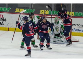 The Regina Pats' Carson Denomie (39) celebrates with teammates after scoring on the Prince Albert Raiders in WHL action at the Brandt Centre on Thursday.