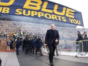 University of Michigan Wolverines men's hockey coach Red Berenson is shown at Michigan Stadium in Ann Arbor, Mich., on Dec. 11, 2010, before an outdoor game against the Michigan State Spartans.
