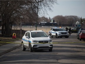 Police sit at a scene on the 1500 block of Cameron Street in Regina, Saskatchewan on April 8, 2021. The area was taped off, as an investigation into the death of 18-year-old Damione Dustyhorn was underway.