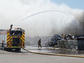 Firefighters work to extinguish a fire at Crown Shred & Recycling Inc in Regina, Saskatchewan on April 8, 2021.

BRANDON HARDER/ Regina Leader-Post