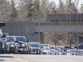 Not enough Saskatchewan people are queuing up for vaccinations like these drivers on Regina's Lewvan Drive last month.