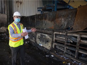 Crown Shred and Recycling general manager Anatoly Davidian explains the extent of damages after a fire at the business in Regina, Saskatchewan on April 9, 2021.