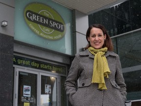 Krystal Kolodziejak, organizer for the Spot A Hero campaign, stands in front of the Green Spot Cafe on Hamilton Street in Regina, Saskatchewan on April 13, 2021.