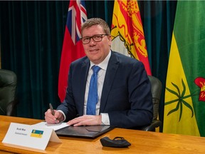 Premier Scott Moe earlier this month signing a memorandum of understanding on small-modular reactors at the Saskatchewan legislature.