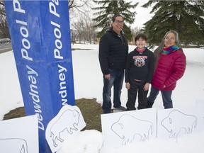 Lorne Kequahtooway, from left, 10-year-old Wiyanna BigEagle-Kequahtooway and Joely BigEagle-Kequahtooway stand in the newly named Buffalo Meadows Park in Regina on Thursday, April 15, 2021.  City council voted nine to two in favour of the name change this week from Dewdney Park.
