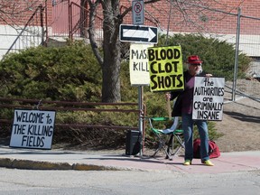 REGINA, SASK : April 21, 2021  -- An anti-vax demonstrator stands outside the Regina General Hospital in Regina, Saskatchewan on April 21, 2021.

BRANDON HARDER/ Regina Leader-Post