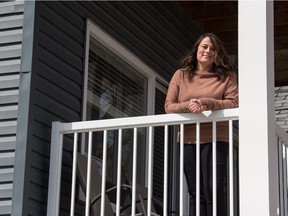 Tanna Young, director of social programs for the John Howard Society, stands in front of Lulu's Lodge, a five-bedroom supportive transitional home for LGBTQ2S+ youth, in Regina, Saskatchewan on April 22, 2021.