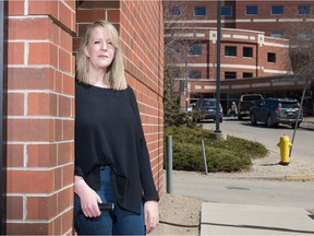 Ashleigh Woytuik stands in front of the Regina General Hospital in Regina, Saskatchewan on April 23, 2021. Woytuik's father has cancer and she says his surgery has been delayed due to ICU capacity issues.