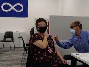 Verna McCallum receives the COVID-19 vaccine at the MN–S pop-up vaccination clinic in Saskatoon on April 23, 2021.