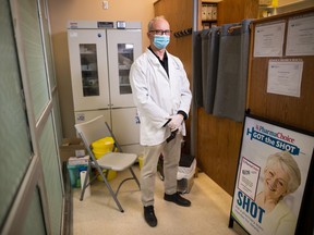 Pharmacist and store manager Brian Gray stands in the vaccination area inside Lakeshore Pharmacy in Regina, Saskatchewan on April 28, 2021. The pharmacy is one of 63 in the province that will receive COVID-19 vaccines as part of a pilot program.