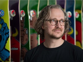 Noel Wendt, founder and owner of the Tiki Room, stands behind the counter at the skateboard shop in Regina on April 30, 2021.