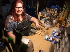 Laura Steadman, a jewelry artist who is shown in her home studio in 2019, is battling COVID-19. Brandon Harder/Regina Leader-Post.