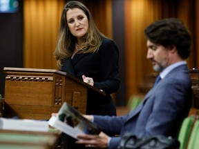 Finance Minister Chrystia Freeland looks at Prime Minister Justin Trudeau as she delivers the budget in the House of Commons on Parliament Hill in Ottawa Monday.