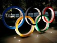 The Olympic rings are illuminated in front of the National Stadium in Tokyo on Jan. 22.