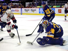 Regina Pats' Carter Chorney (22) is stopped by Saskatoon Blades goalie Nolan Maier (73) on April 20, 2021 at the Brandt Centre. Keith Hershmiller Photography.