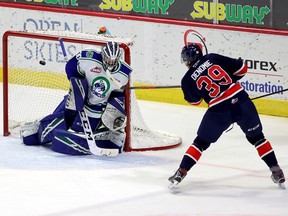 The Regina Pats' Carson Denomie, 39, shown scoring against the Swift Current Broncos' Reid Dyck, has 12 goals in 14 games this season.