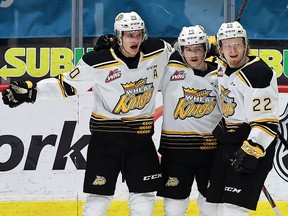 Brandon Wheat Kings' Lynden McCallum (20, left) celebrates one of his four goals against the Regina Pats at the Brandt Centre on April 25, 2021. Keith Hershmiller Photography.