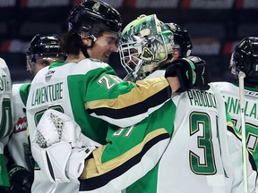 Prince Albert Raiders' Tyson Laventure congratulates goaltender Max Paddock on a 2-0 shutout victory over the Moose Jaw Warriors at the Brandt Centre on Thursday at the Brandt Centre.