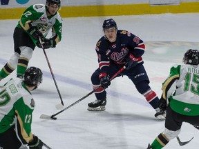 Connor Bedard, shown with the puck March 25 against the Prince Albert Raiders, has eight goals and 12 assists in his first 11 games with the Regina Pats. He has yet to be held off the scoresheet.