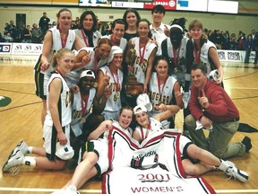The University of Regina Cougars celebrate after winning the Canadian university women's basketball championship on March 11, 2001.