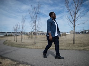 Charles Umeh, southern artistic director at Common Weal Community Arts, walks near his home in Regina, Saskatchewan on April 30, 2021.