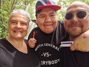 Matthew Brandon (middle) and his foster parents Shannon Berard-Gardiner and Chris Gardiner took part in the Regina Public Library blog project. Berard-Gardiner said the library staff feel like family to them.