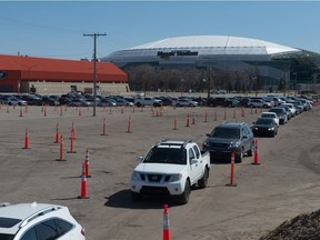 Vehicles line up for the drive-thru COVID-19 vaccine clinic at Evraz Place in Regina, Saskatchewan on May 4, 2021. BRANDON HARDER/ Regina Leader-Post