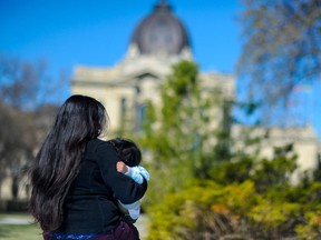 The NDP raised the issue of Ms. "Jo" Pereira and her son (pictured above) in the Saskatchewan legislature on May 6, 2021. Both contracted COVID-19 but encountered difficulty with health coverage. She is here on a student visa, while her child was born here. Photo by David Bruce.