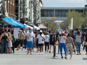 Visitors peruse the Regina farmer's market in downtown Regina, Saskatchewan on May 15, 2021.