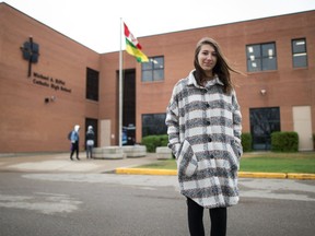Danica Giambattista, a Grade 12 student at Michael A. Riffel Catholic High School, stands in front of the school in Regina, Saskatchewan on May 20, 2021. Giambattista has been advocating for in-person graduation ceremonies.