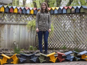 Angela Tremka in her backyard with some of the birdhouses she is planning to distribute around the Cathedral area in Regina. Tremka received a $1,600 micro-grant from the Cathedral Area Community Association (CACA), which she used to build 50 bird houses and 40 nest shelves.