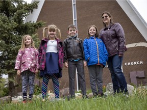 Laura French, right, a volunteer with Immanuel Anglican Church, stands with her children Sandrine, Eleanor, James and Cynthia in front of the former St. Luke's Anglican Church on Argyle Road. St. Luke's was one of five parishes that were incorporated into Immanuel Anglican after their attendance started to decline.›