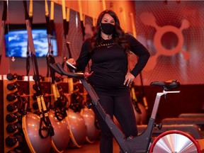 Nadine Newton, pictured here, runs OrangeTheory Fitness with Skye Kaiss. She stands inside the south location in Regina in an area that has been cleared for disinfection.