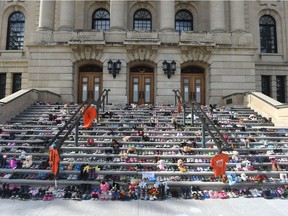 Children's shoes in a display to represent children who died while in Canada's residential school program are seen on the steps of the Saskatchewan Legislative Building in Regina on May 31, 2021.

BRANDON HARDER/ Regina Leader-Post