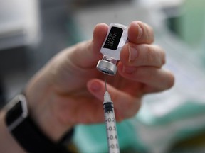 A syringe of the Pfizer-BioNtech Covid-19 is prepared at a French military base on May 11, 2021