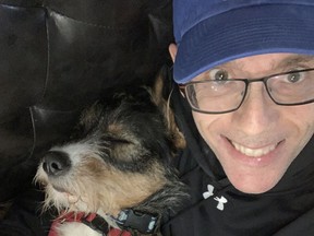 Rob Vanstone with his then-foster dog, the recently adopted Candy, during their first bonding moment on April 21.