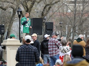 People's Party of Canada leader Maxime Bernier, wearing a Saskatchewan Roughriders jersey, is shown speaking at Saturday's anti-mask rally at VIctoria Park.