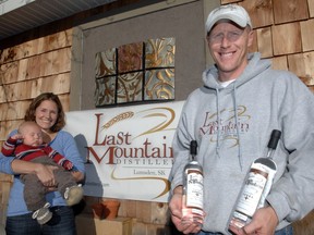 Meredith and Colin Schmidt with their son Ryker at Last Mountain Distillery in Lumsden, Sask. in this September 2011 file photo.