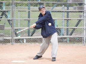 Leader-Post sports editor Rob Vanstone takes a swing at a baseball at Kiwanis Park.