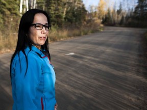 Lac La Ronge Indian Band chief Tammy Cook-Searson walks alongside the Montreal River in La Ronge, Saskatchewan on Monday, October 3, 2016. (Kayle Neis/Saskatoon StarPhoenix)