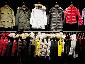 Coats hang in the show room of the Canada Goose Inc. manufacturing facility in Toronto, Ontario, Canada, on Thursday, Feb. 27, 2014.