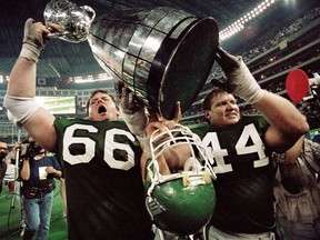 Saskatchewan Roughriders offensive linemen Mike Anderson, 66, and Roger Aldag, 44, celebrate after the 1989 Grey Cup victory — an event that was documented in Rob Vanstone's second book.