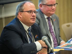 City of Regina executive director finance and corporate services Barry Lacey, left, responds to a question from a reporter regarding the city budget at Regina City Hall on Nov. 16, 2018.