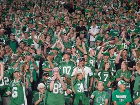 Saskatchewan Roughriders fans cheer during a game against the Hamilton Tiger-Cats at Mosaic Stadium. BRANDON HARDER/ Regina Leader-Post