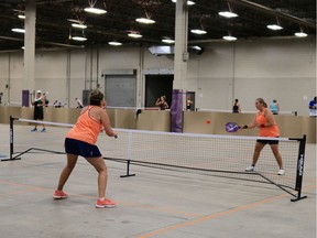 Athletes compete in a pickleball tournament in the Canada Centre Building at Evraz Place in 2019. The site could soon be home to more permanent courts.