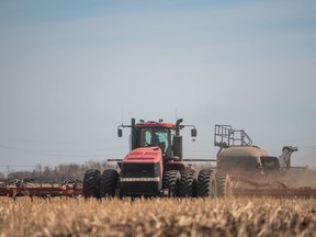 A seeder plants wheat in a field near Saskatoon on April 27, 2021.