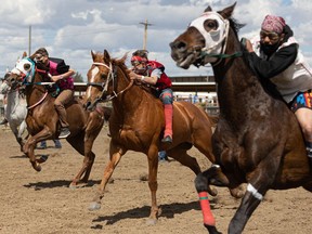 Joseph Jackson (second from right) competes in the home opener Indian Relay Races at Marquis Downs in Saskatoon on May 30, 2021. (Saskatoon StarPhoenix / Michelle Berg)