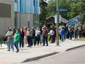 REGINA, SASK : June 10, 2021  -- People stand in line for a walk-in COVID-19 vaccine clinic at the mâmawêyatitân centre in Regina, Saskatchewan on June 10, 2021.

BRANDON HARDER/ Regina Leader-Post
